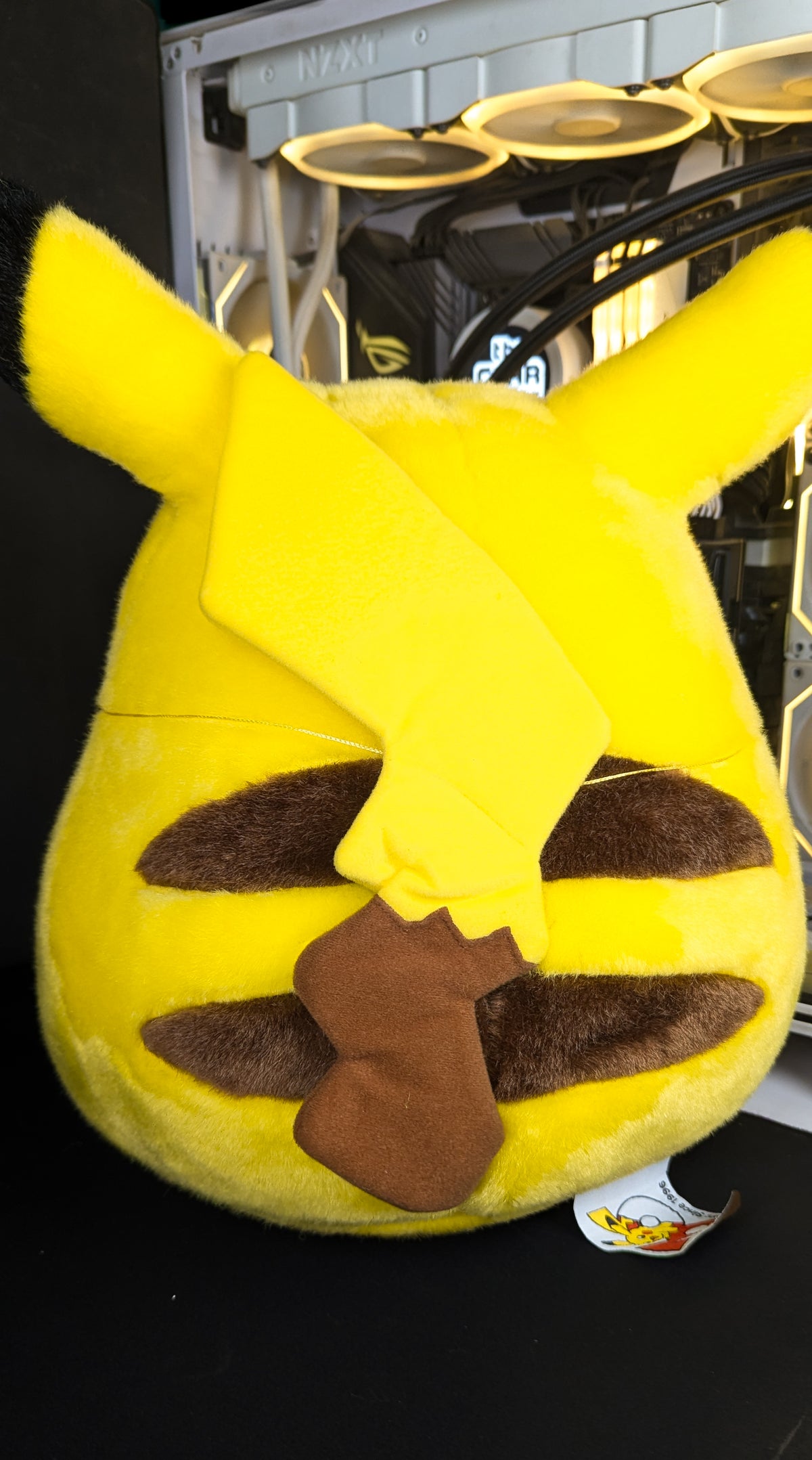 Back of the Welcome Back! Pikachu 1/1 life-size plush showing the three brown stripes and the brown tail patch