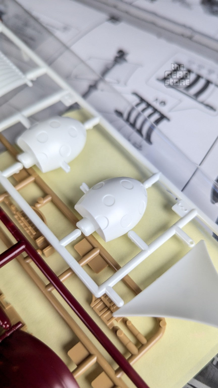 White and tan molded parts for the Oro Jackson model kit
