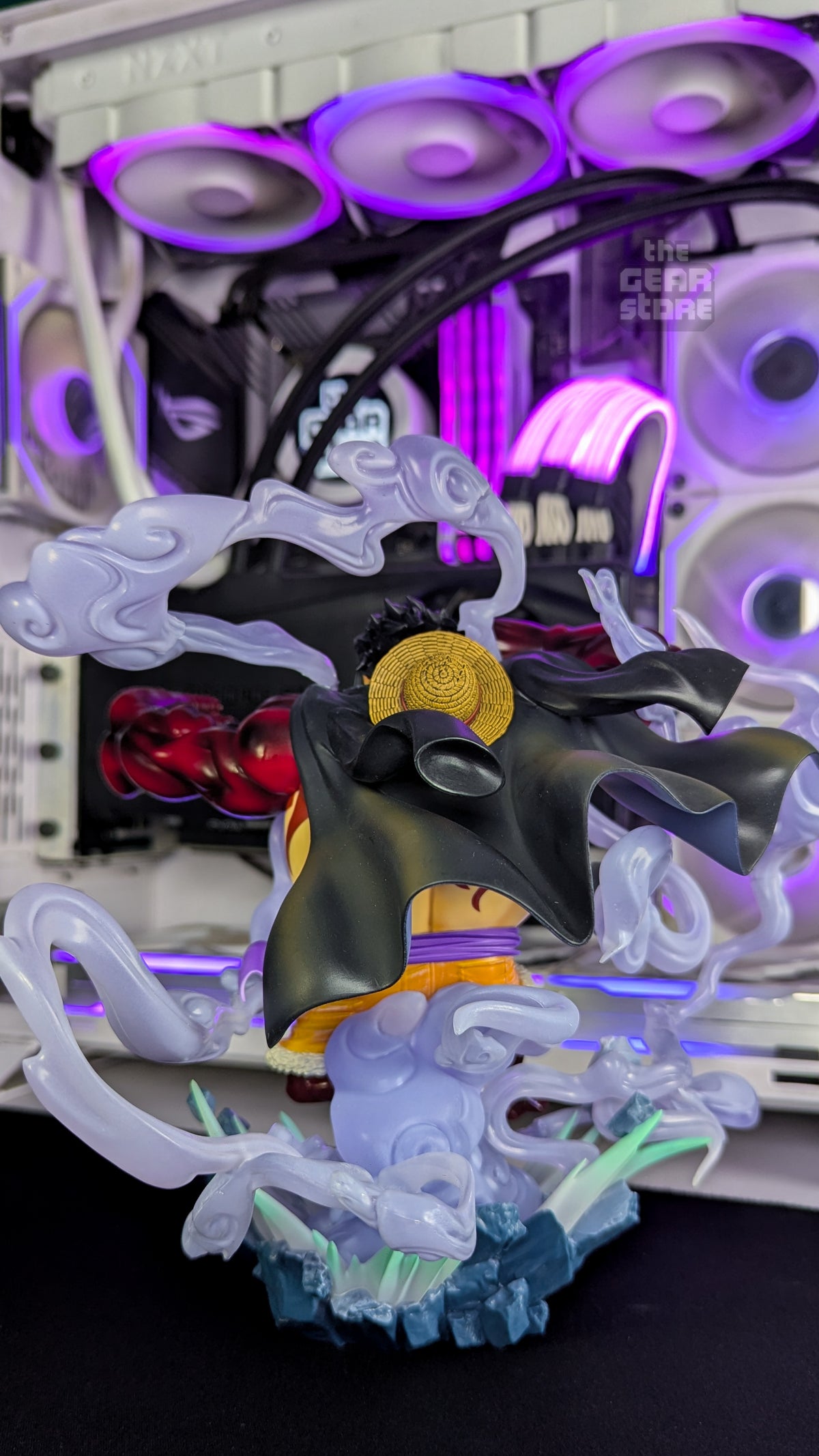 Rear three-quarter view of the Gear 4 Luffy figure, with coat, straw hat and translucent steam effects
