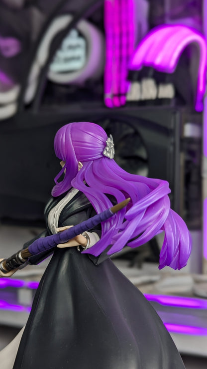 Side view of Fern mid-turn with her staff and flowing hair