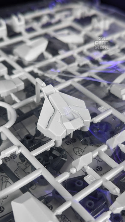Sealed runners of white and grey parts inside the Gundam AGE-FX kit box