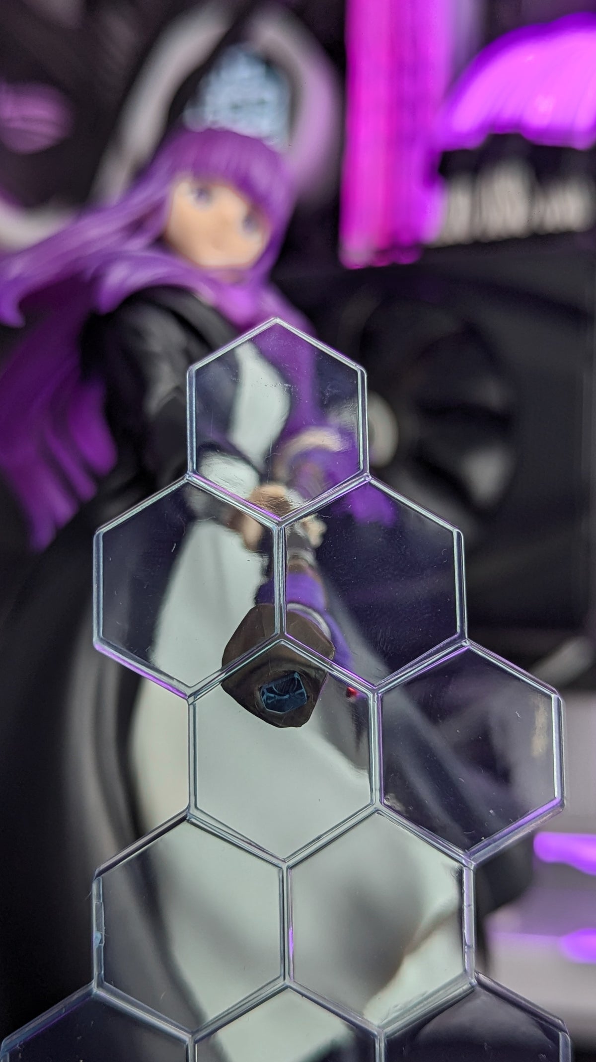 Fern's staff tip seen behind the hexagonal barrier effect parts