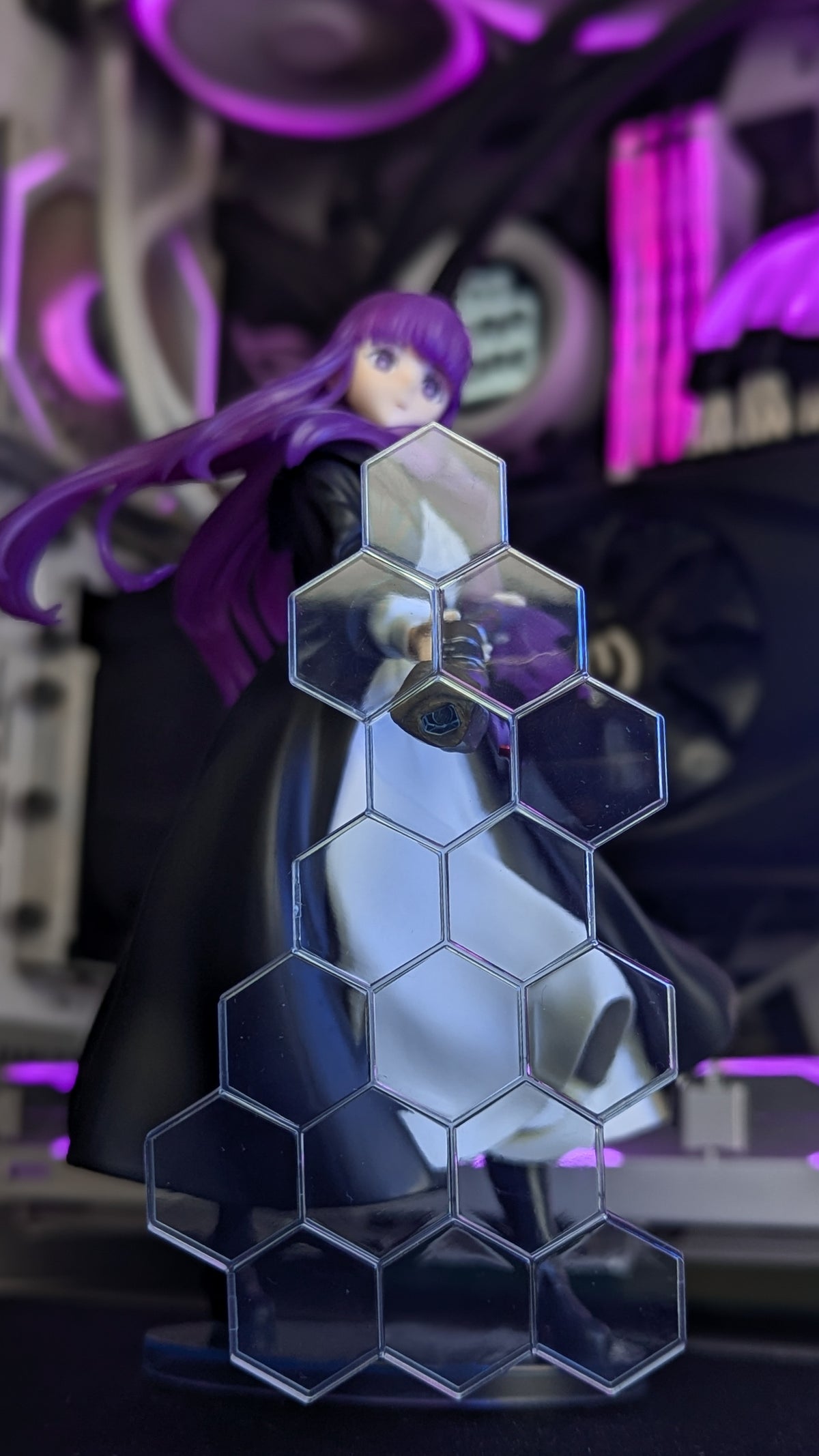 Fern's translucent blue hexagonal defence magic effect parts in front of the figure