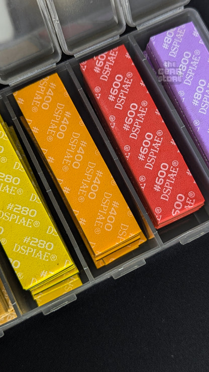 DSPIAE sanding sponges in #280, #400, #600 and #800 sitting in their colour-coded case compartments