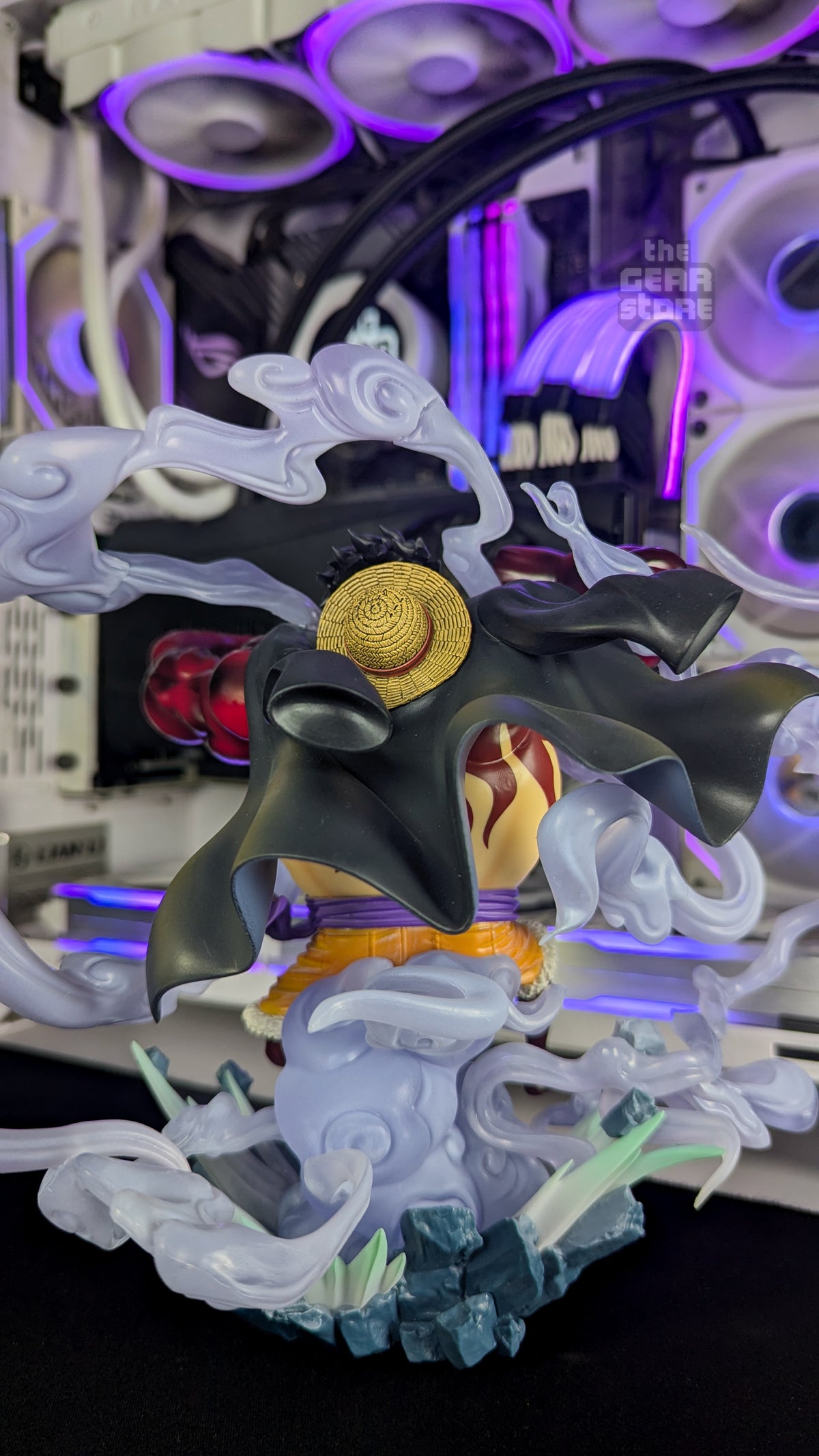 Back of the Gear 4 Luffy figure, showing his flared black coat with the straw hat hanging behind